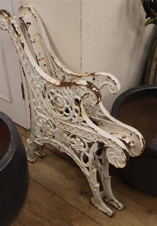 A pair of Victorian Coalbrookdale design cast iron bench ends W.65cm approx.